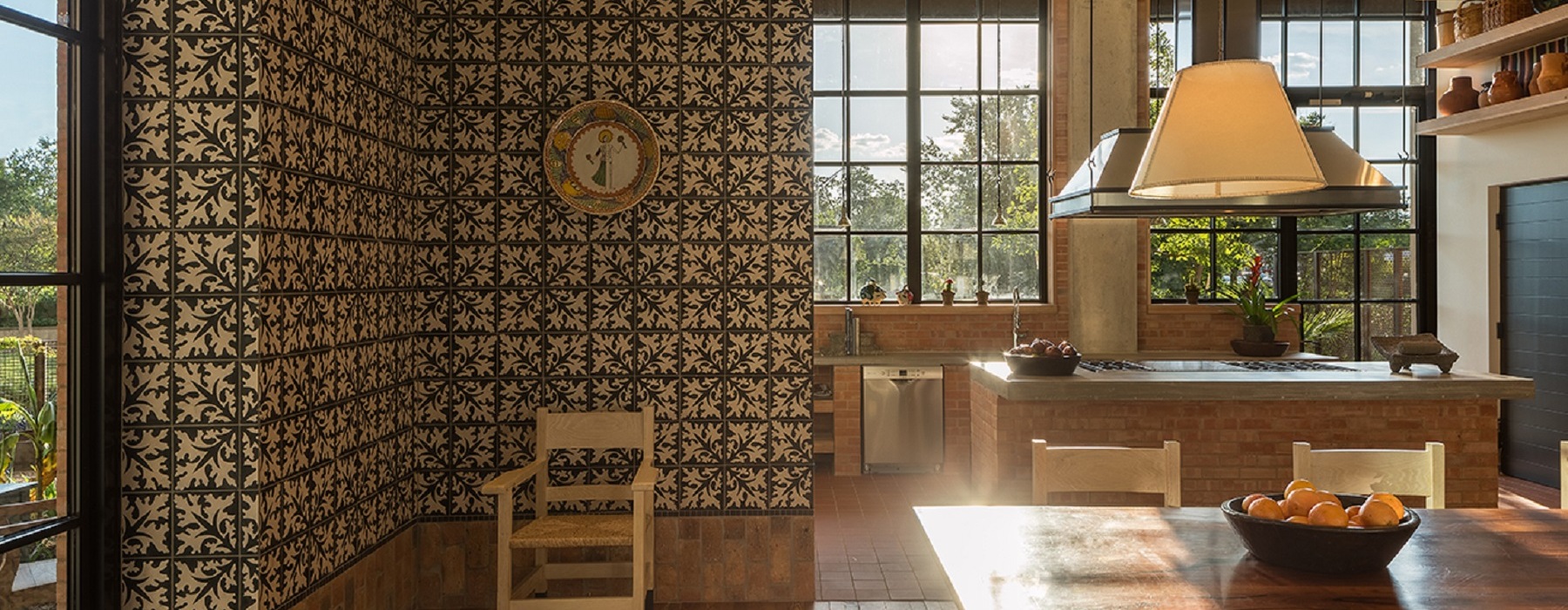 kitchen with an island, ample lighting and a wooden dining room table