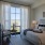 bedroom with a large window and modern decor
