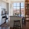 kitchen with an island, a built-in area of books and shelving, modern appliances and spacious counter-space