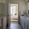 bathroom with access to the bedroom and a large walk-in shower area